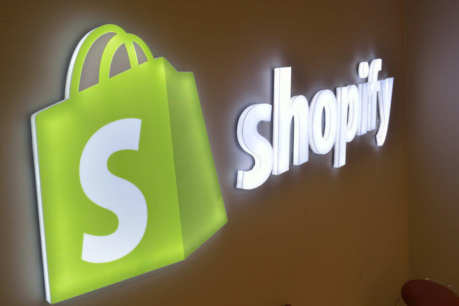 A Shopify sign mounted on a wall, suggesting that this might be a photo of the outside of one of Shopify website builder's branch offices